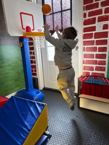 Leaping at the basketball hoop