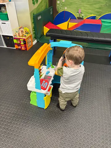 Two children building a tower together