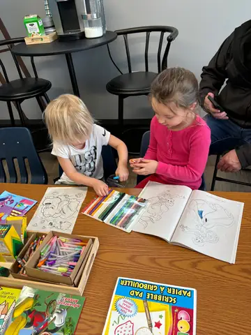 Children drawing at the craft table
