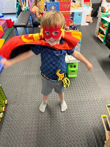 Superhero capes at the dress-up station
