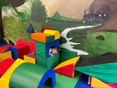 Foam blocks in front of the hand-painted mural