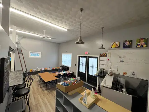 The front desk and check-in counter under pendant lighting
