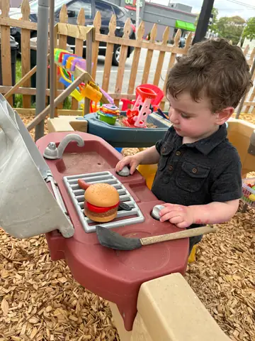 Cooking at the outdoor mud kitchen