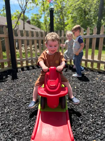 Riding a scooter through the outdoor yard