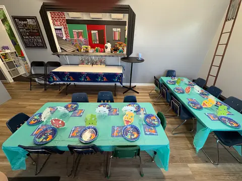 Themed plates and tablecloths, set before a party
