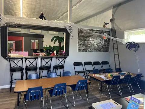 The Snack Stop with barstools, cafe counter, and kid-sized snack tables