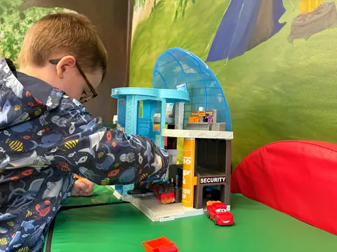 A child at the village playset