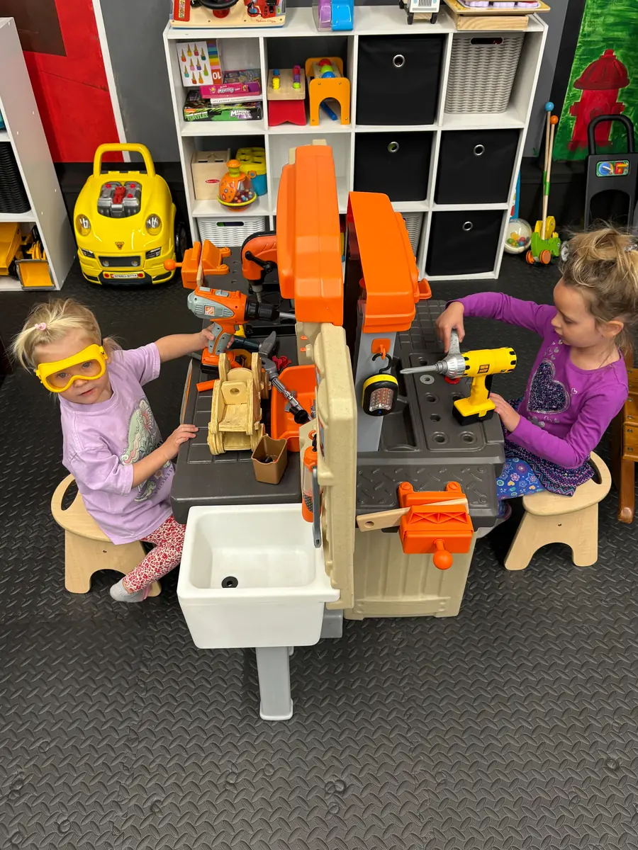 Children building at the tool bench